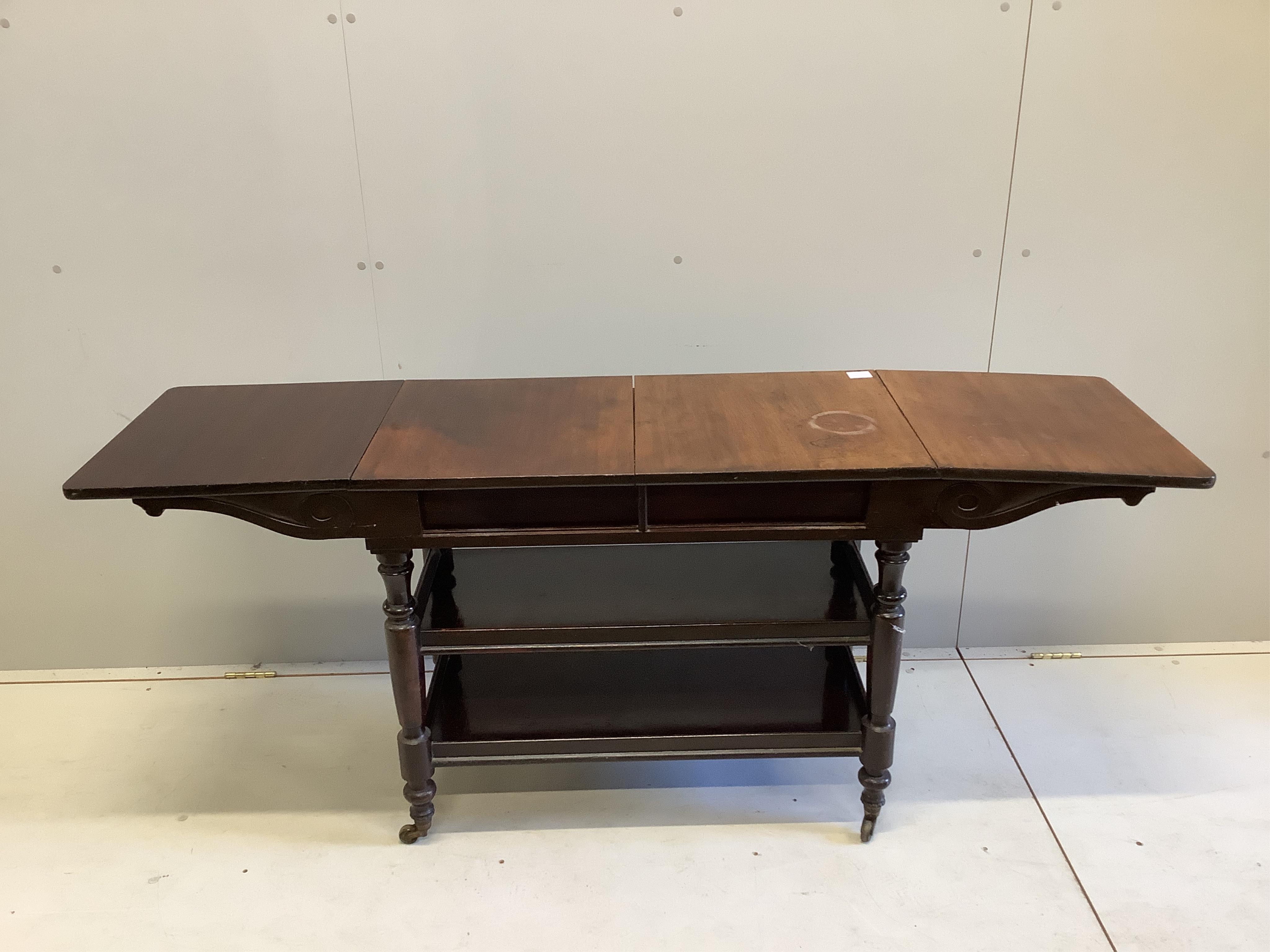 A Victorian mahogany drop flap three tier side table, width 89cm, depth 45cm, height 72cm. Condition - fair